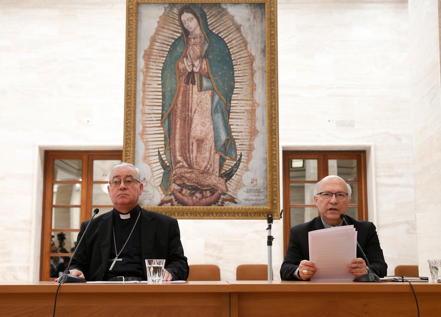 Bishop Juan Ignacio Gonzalez Errazuriz of San Bernardo, Chile, and Auxiliary Bishop Fernando Ramos Perez of Santiago, Chile, attend a press conference in Rome May 18. Bishop Gonzalez said every bishop in Chile offered his resignation to Pope Francis after a three-day meeting with him at the Vatican.